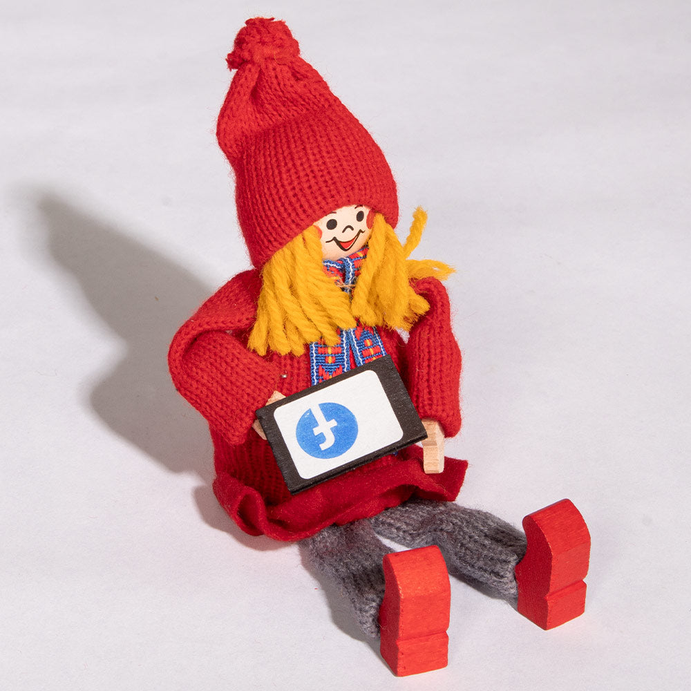 Tomte Girl Sitting with iPad (2021)
